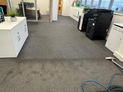 very dirty office floor being cleaned